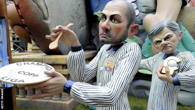 Papier mache figures of Guardiola and Mourinho created for a Spanish festival