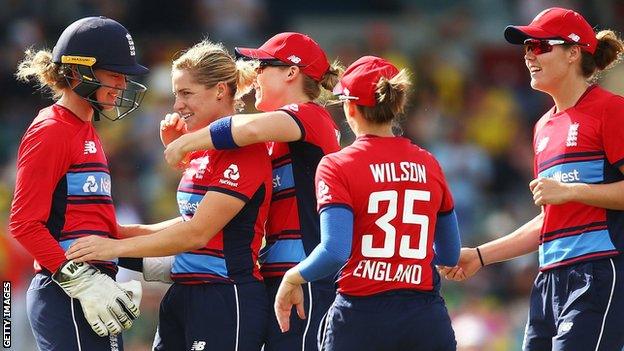 England celebrate a wicket by Katherine Brunt (second left)