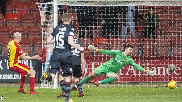 Conor Sammon side-foots home Thistle's third goal