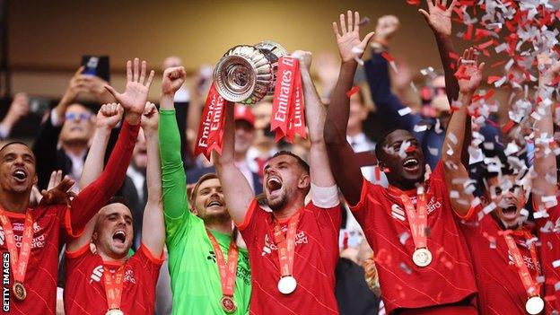 Jordan Henderson lifts the FA Cup