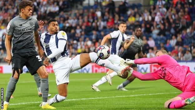 West Bromwich Albion's Karlan Grant (centre) is thwarted by Cardiff keeper Ryan Allsop (right)