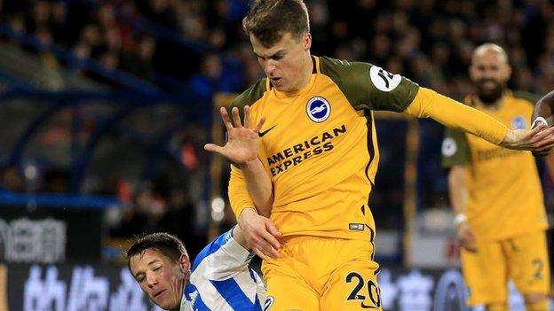 Solly March in action for Brighton against Huddersfield in the Premier League