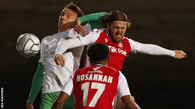 Yeovil's Daniel Moss in action against Wrexham's Jordan Ponticelli