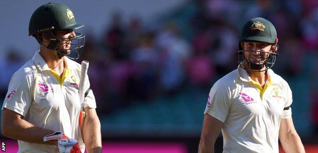 Mitchell Marsh and Shaun Marsh smile as they leave the pitch