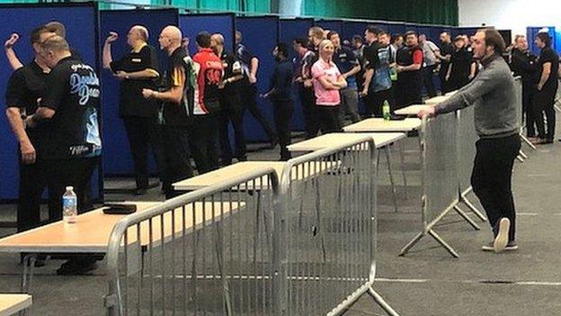 Fallon Sherrock poses for a photo during a break in practice at darts Q School