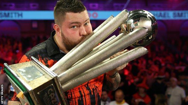 Michael Smith with the PDC World Championship trophy