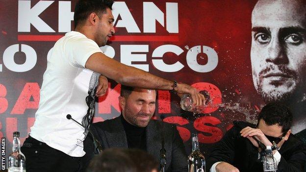 Amir Khan throws water over Phil Lo Greco