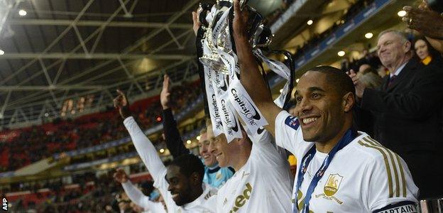 Ashley Williams lifts the League Cup in 2013