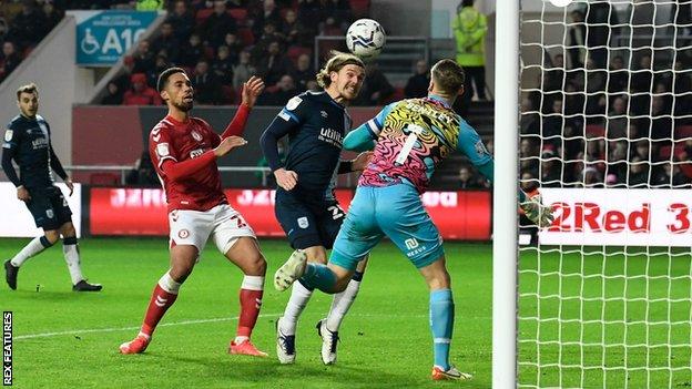 Danny Ward heads the ball past Bristol City keeper Dan Bentley