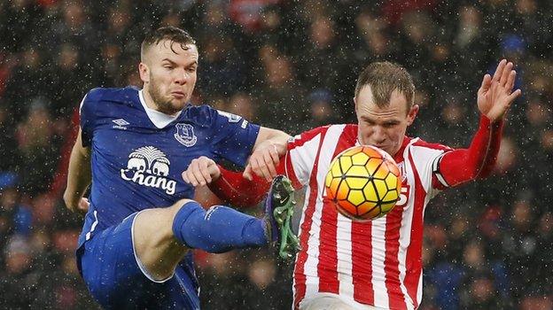 Everton midfielder Tom Cleverley (left) and Stoke's Glenn Whelan