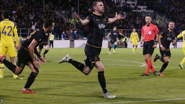 Dundalk forward Ciaran Kilduff runs away in celebration after scoring against Maccabi Tel-Aviv