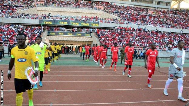 Simba in red before a match against Ghana's Asante Kotoko in 2018