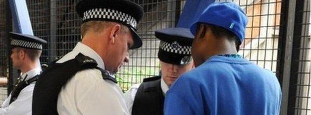 Police officers conduct a stop and search in 2008