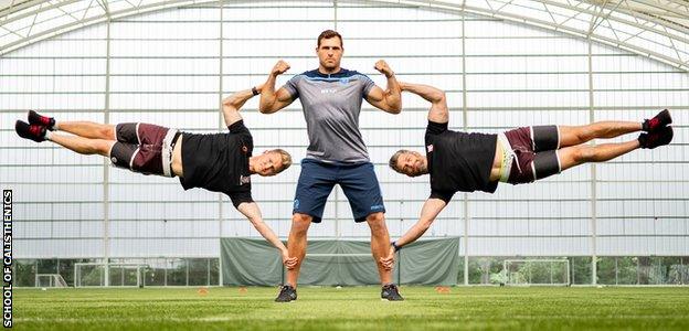 Sean Lamont, David Jackson and Tim Stevenson performing a human flag exercise