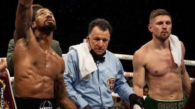 Andrade knocked Quigley down three times in his successful title defence