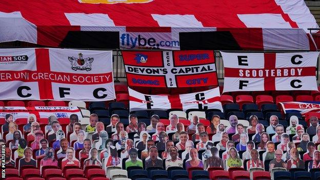 Exeter cardboard cut-outs and flags