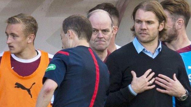 Hearts manager Robbie Neilson (centre right)