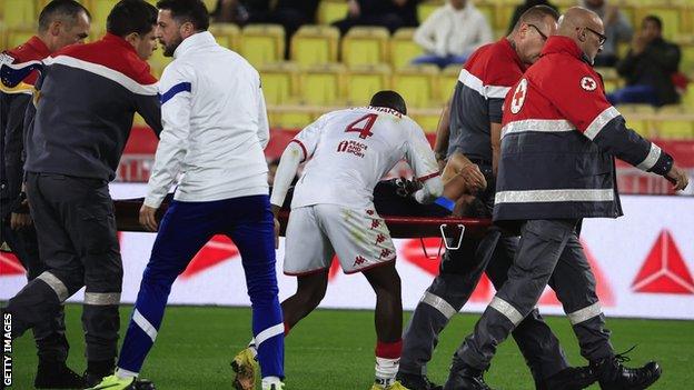 Morocco forward Amine Harit is stretchered off after suffering a knee injury