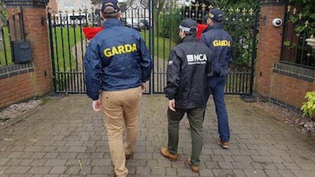 National Crime Agency officers along with garda officers