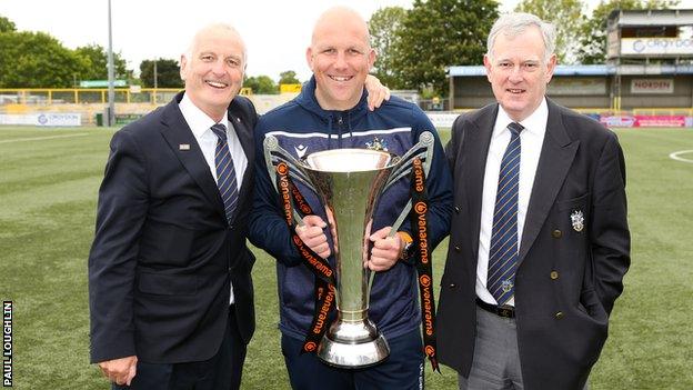 Sutton manager Matt Gray is flanked by chairman Bruce Elliot and vice chairman Adrian Barry