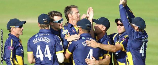 Glamorgan celebrate taking a wicket against Essex