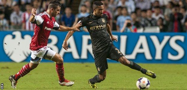 Jack Sealy with Manchester City's Gael Clichy during City's pre-season tour of 2013