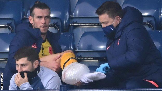 Gareth Bale receives treatment at the Hawthorns