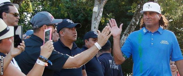 Pat Perez of the United States celebrates with fans after winning the OHL Classic at Mayakoba on November 13, 2016