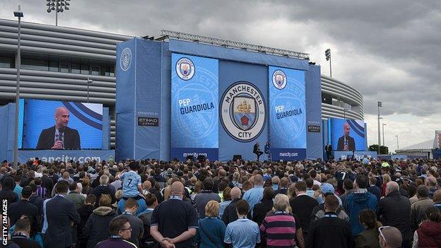 Pep Guardiola is introduced to Manchester City's fans at an event shortly after his appointment in 2016