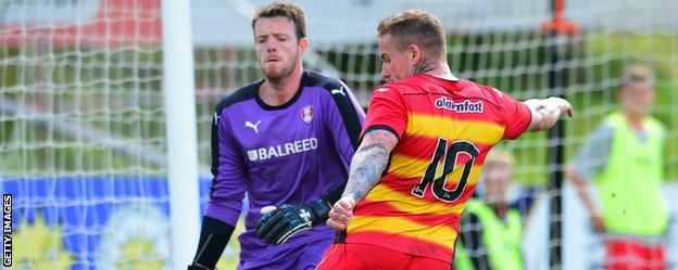 Rotherham United goalkeeper Adam Collin (left) in action against Partick Thistle