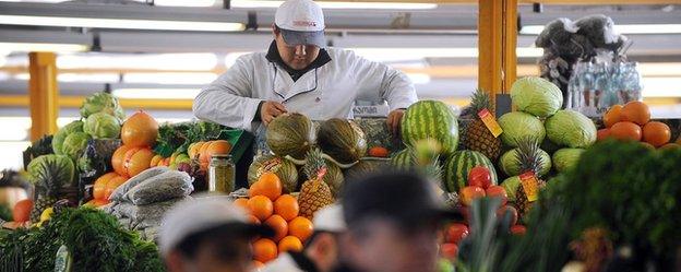 A vendor prepares vegetables in Moscow's Dorogomilovsky Market on February 16, 2011.