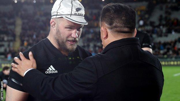 Owen Franks (left) is presented with a cap to mark his 100th Test appearance for New Zealand