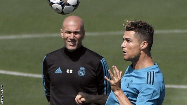 Real Madrid manager Zinedine Zidane watches Cristiano Ronaldo during training