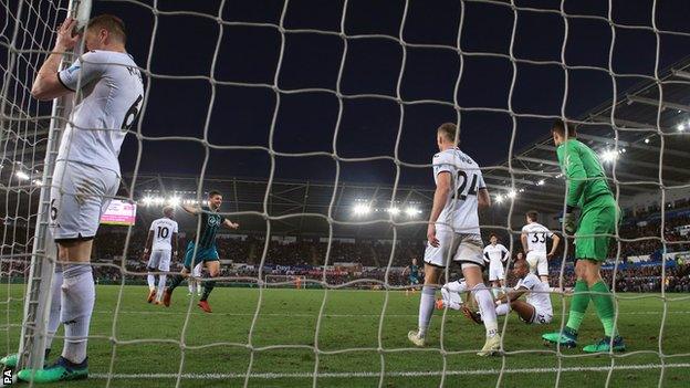 Swansea players react after conceding to Southampton in the penultimate game of the season