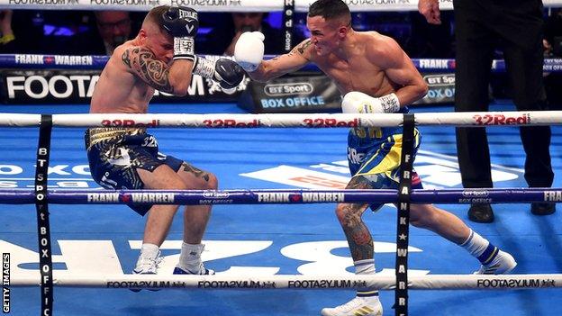 Josh Warrington nearly sends Carl Frampton crashing to the canvas during their IBF featherweight word title fight