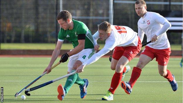 Ireland's Jonathan Bell comes under pressure from Polish pair Jack Kurowski and Patrick Bulka