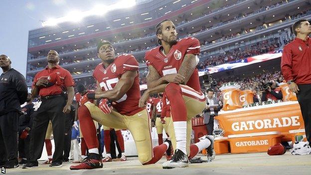 Eric Reid (left) and Colin Kaepernick kneel during the national anthem