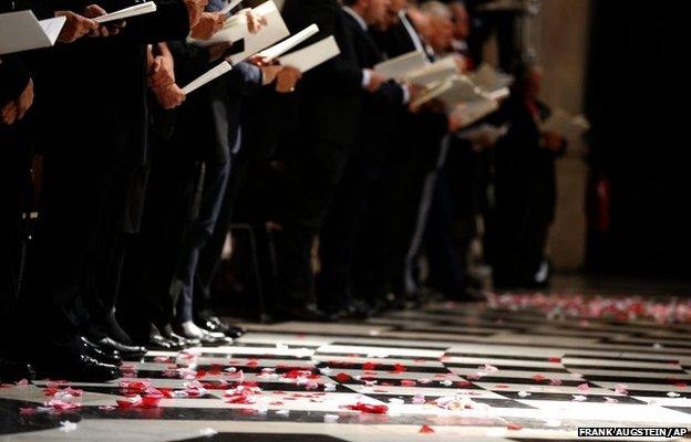 Poppy petals lie on the floor during a service in St Paul's Cathedral