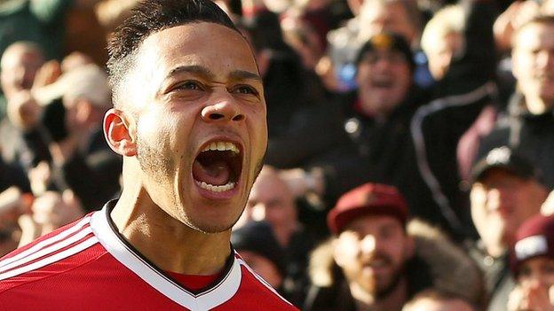 Manchester United winger Memphis Depay celebrates scoring a goal