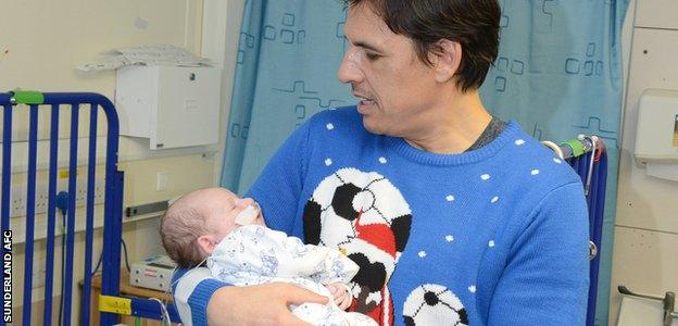 Sunderland manager Chris Coleman holds baby Logan Steel