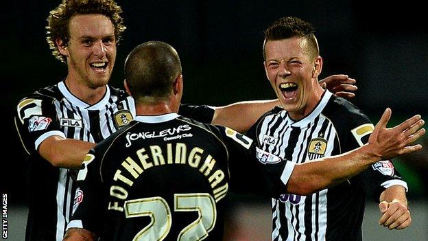 Callum McGregor (right) celebrates scoring on his Notts County debut against Fleetwood Town in the Capital One Cup