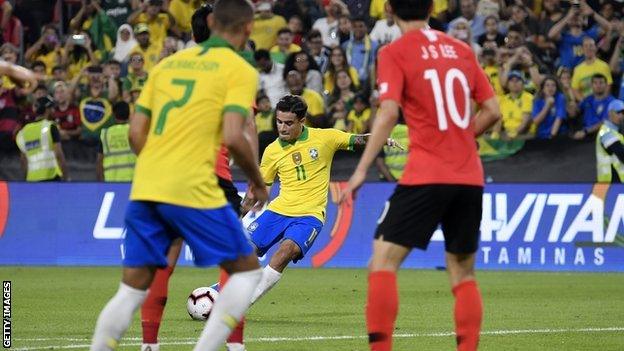 Philippe Coutinho scores with a free-kick