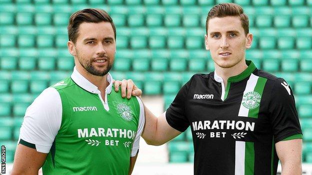 Hibs defenders Darren McGregor and Paul Hanlon model next season's kit