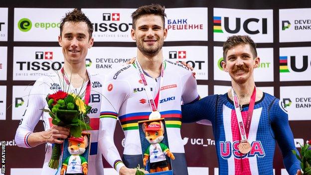 Britain's silver-medallist John Archibald (left), Italy's gold-medallist Filippo Ganna (centre) and American bronze-medallist Ashton Lambie (right) on the podium for the men's 4km individual pursuit at the Track Cycling World Cup in Minsk