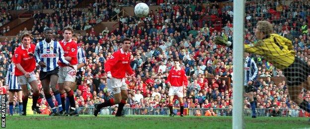 Steve Bruce scores against Sheffield Wednesday in 1993