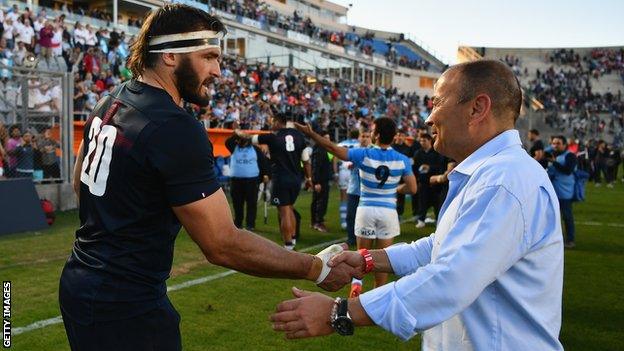 Eddie Jones (right) shakes Don Armand's hand