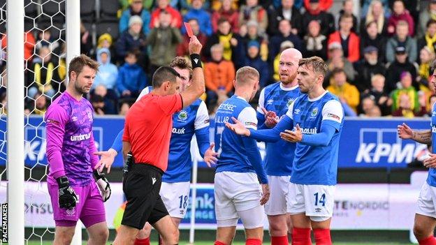 Kirk Millar receives a red card for handball