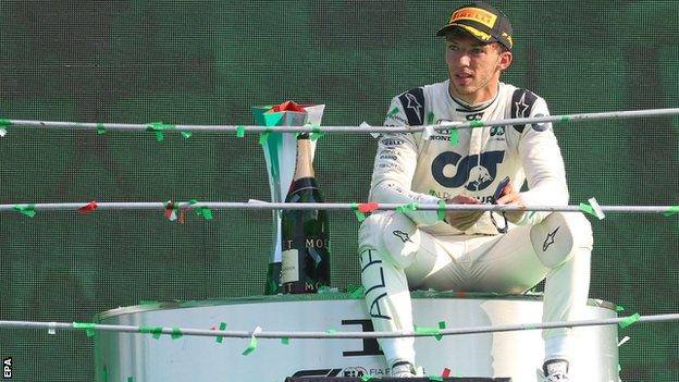 Pierre Gasly sits alone on the podium