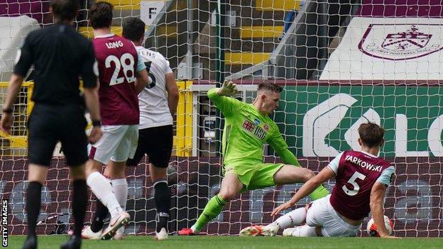 James Tarkowski slides in to score for Burnley against Sheffield United