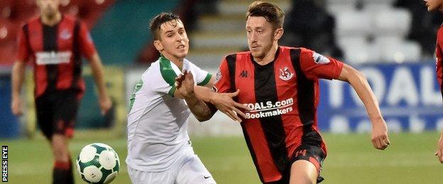 Crusaders Jordan Forsythe evades the challenge of Olimpija's Nik Kapun